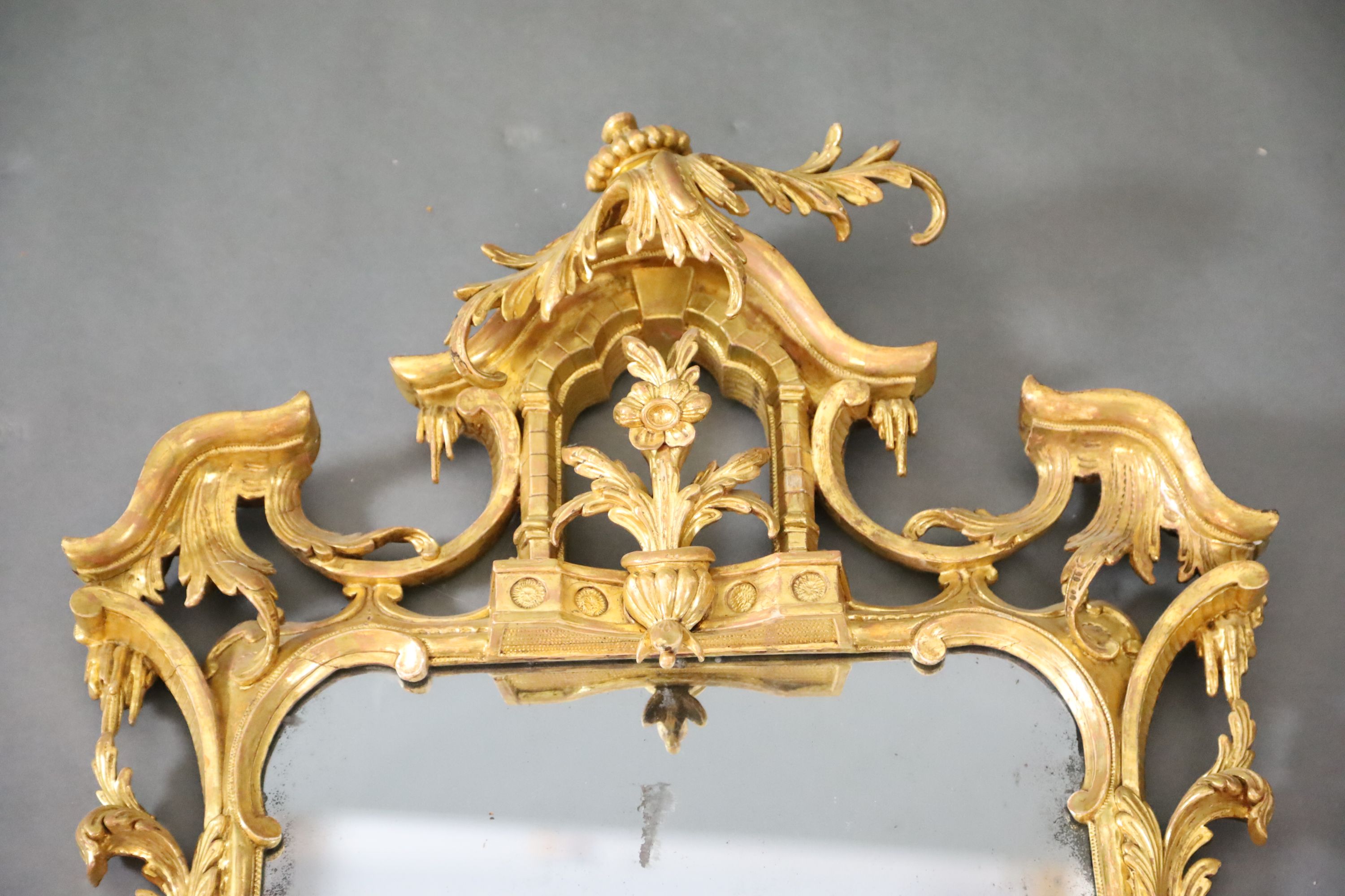 A George III Chippendale style carved giltwood wall mirror, W.1ft 10in. H.3ft 6in.